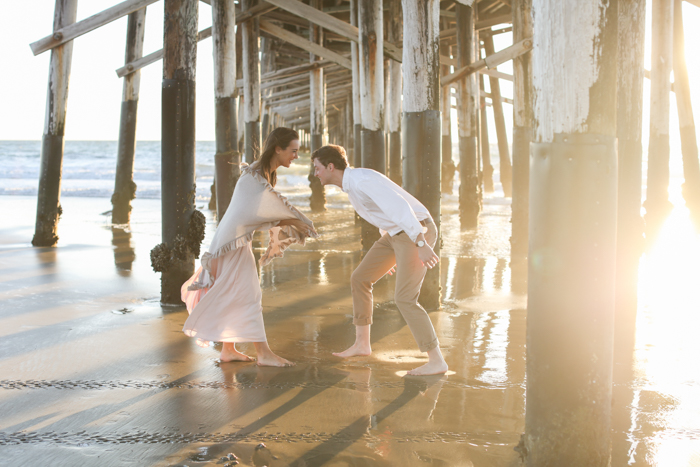 playful couples beach shoot