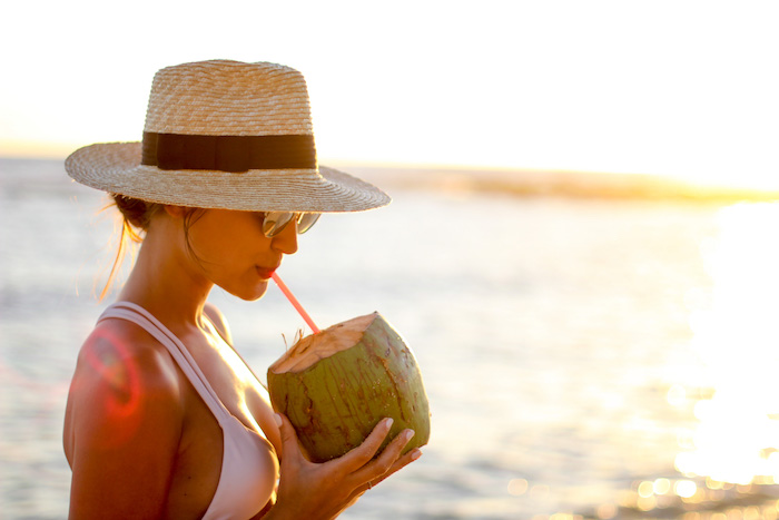 drinking from a coconut