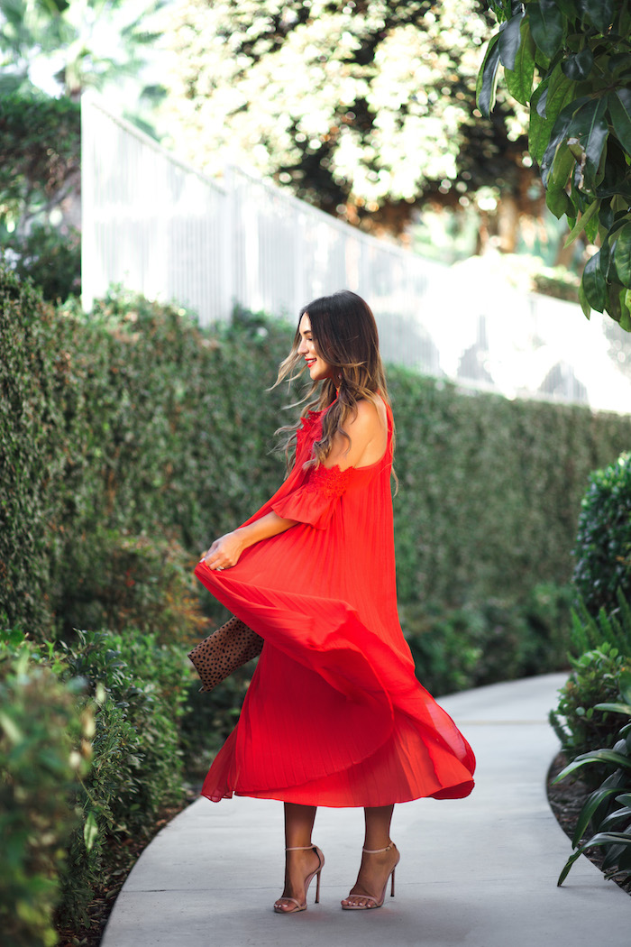 twirling red midi dress
