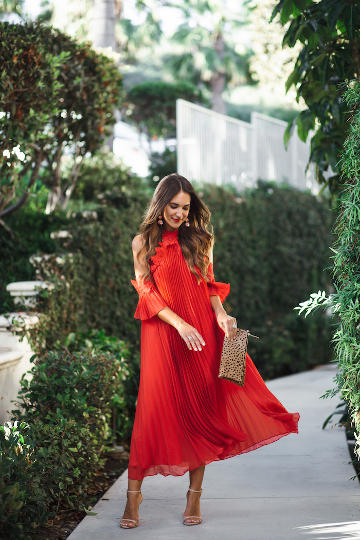 red pleated midi dress with leopard purse