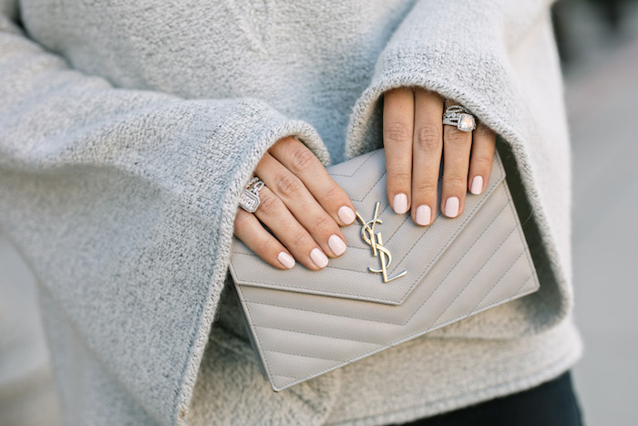 gray ysl wallet on a chain