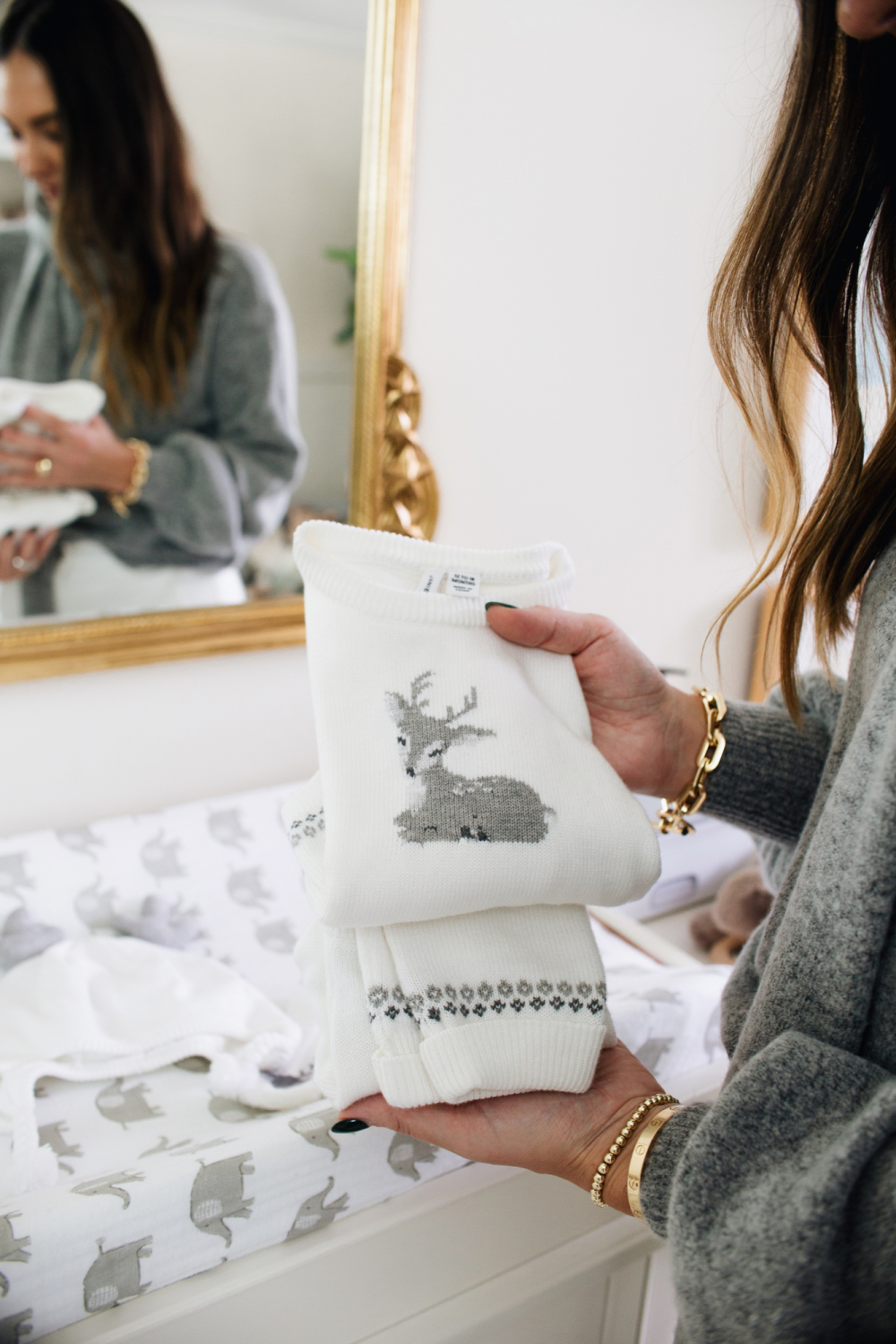 white and gray baby sweater