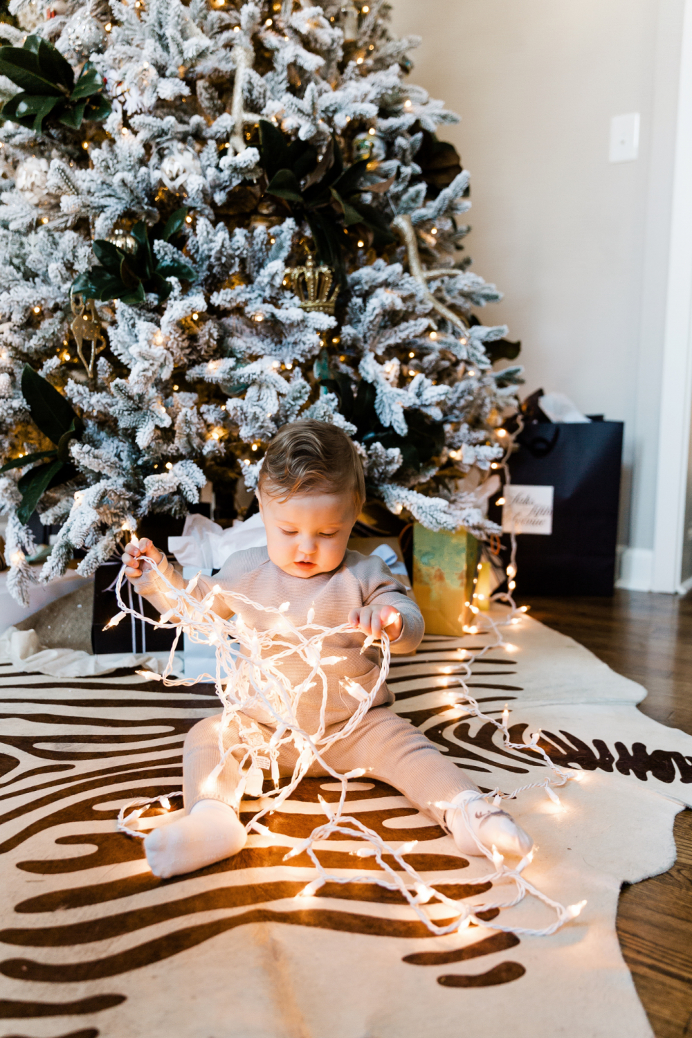 baby with twinkle lights